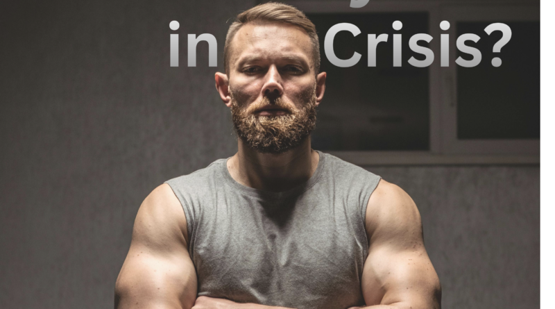 A Man stands in a gray sleeveless shirt with his arms crossed looking sternly into the camera with the title caption, Masculinity in crisis?